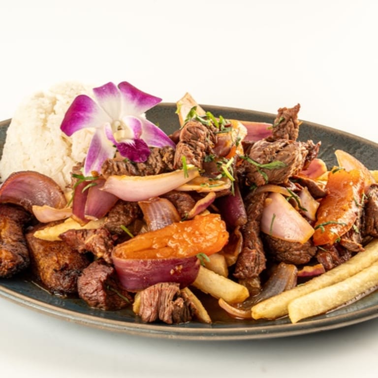 Savor Our Irresistible Salchipapas Delight