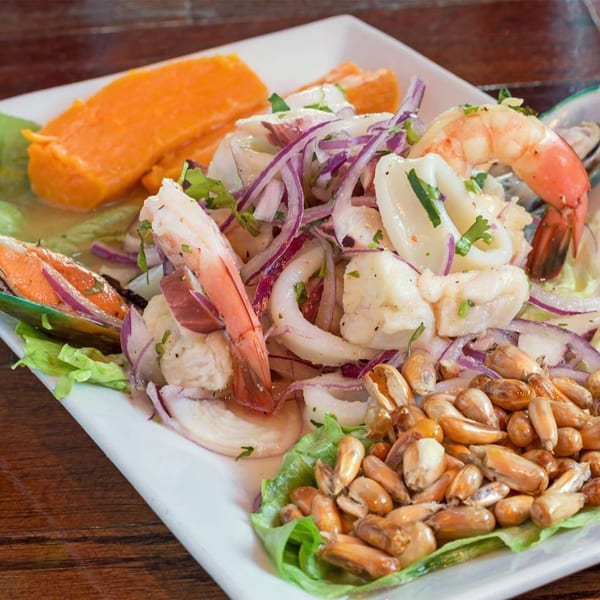 Mambo's Cafe ceviche with shrimp, squid, mussels, red onion, sweet potato, and toasted corn.